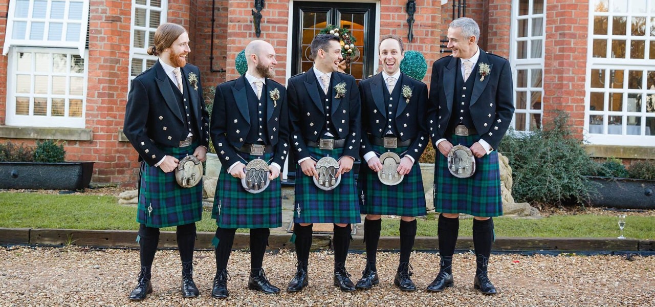 Stock photo of Men wearing traditional scottish costume of kilt and  sporran, The Orkney…. Available for sale on www.naturepl.com